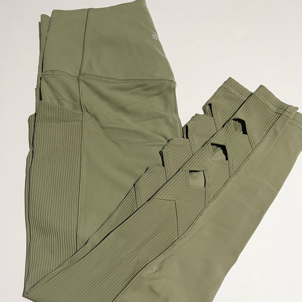 Athleta salutation stash pocket leggings with cutouts
